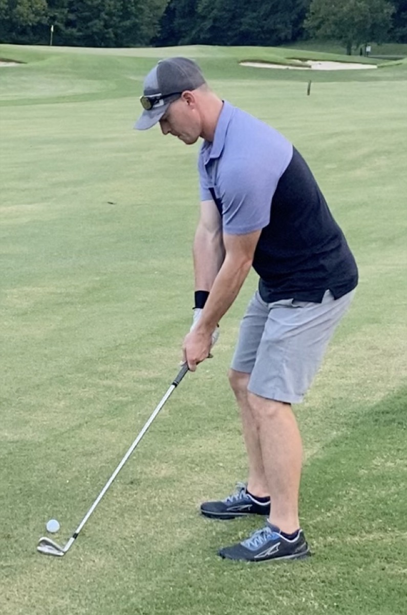 Cory Harrilchak addressing the ball on the fairway